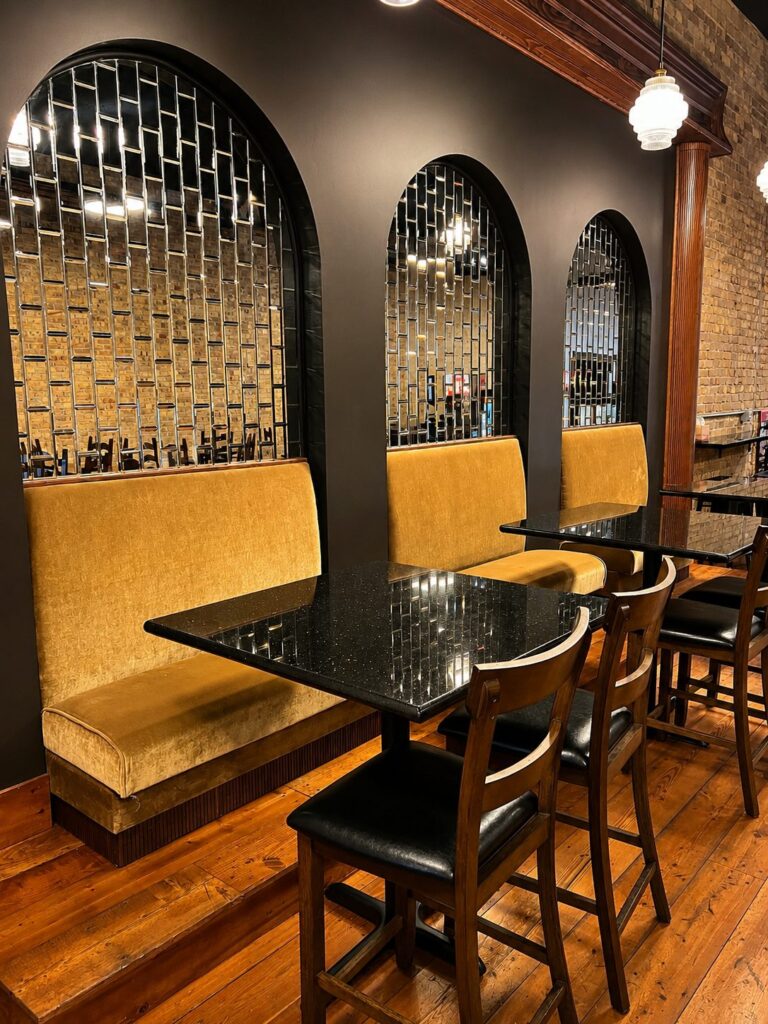 Arched booth seating with warm lighting
