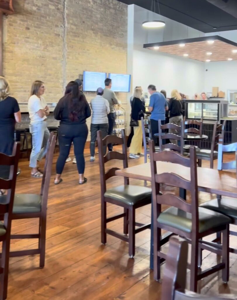 Guests gathered inside The Square Bagel Co.